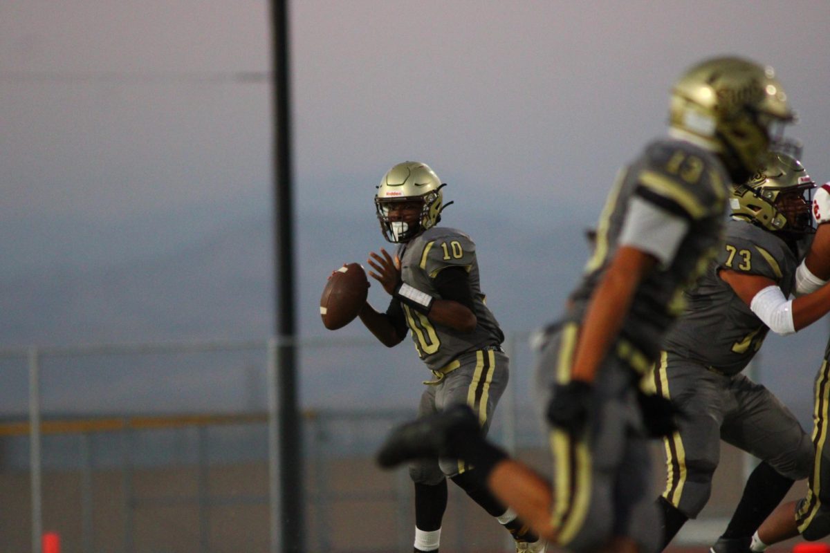 Suns quarterback Keenan Starling scans the field for an open receiver during Thursday's game against Cesar Chavez High.