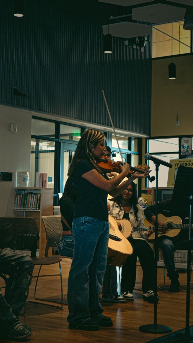 Estefany Cano plays the violin during Friday's Mariachi Rayos de Oro performance.