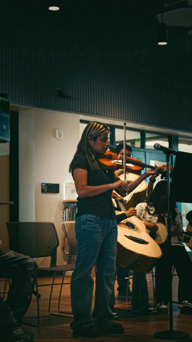 Estefany Cano plays the violin during Friday's Mariachi Rayos de Oro performance.