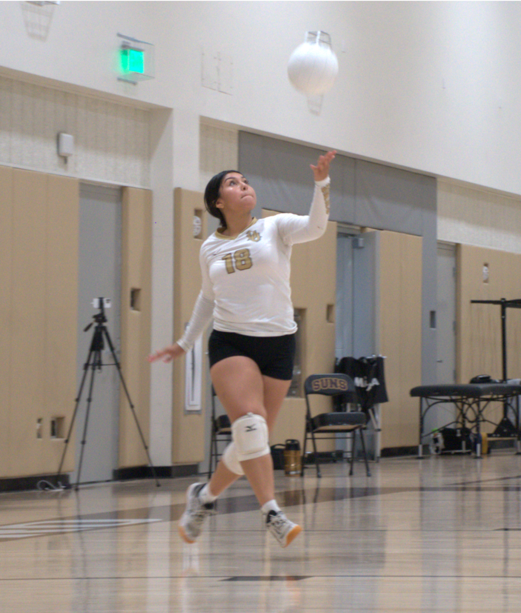 Nayomi Mosqueda serves the ball during Tuesday's match against West. 