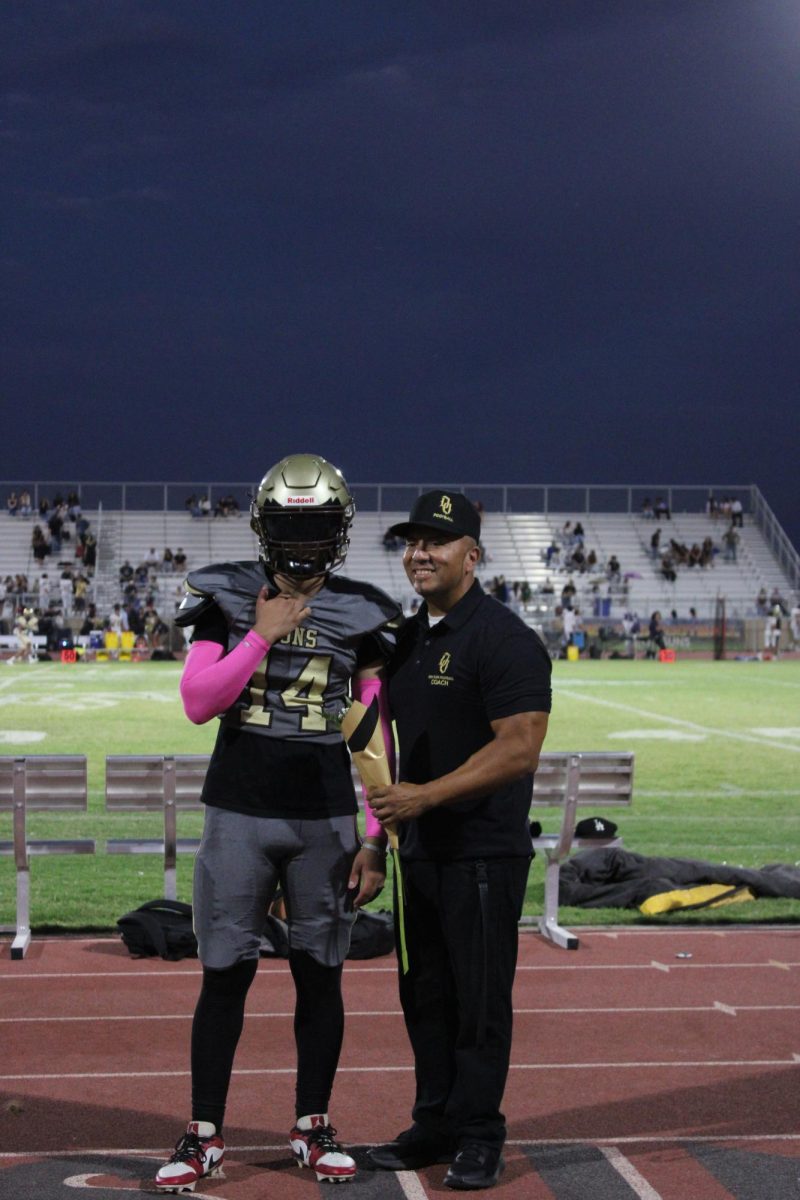 Ali Nasher and varsity football coach Pete Hernandez