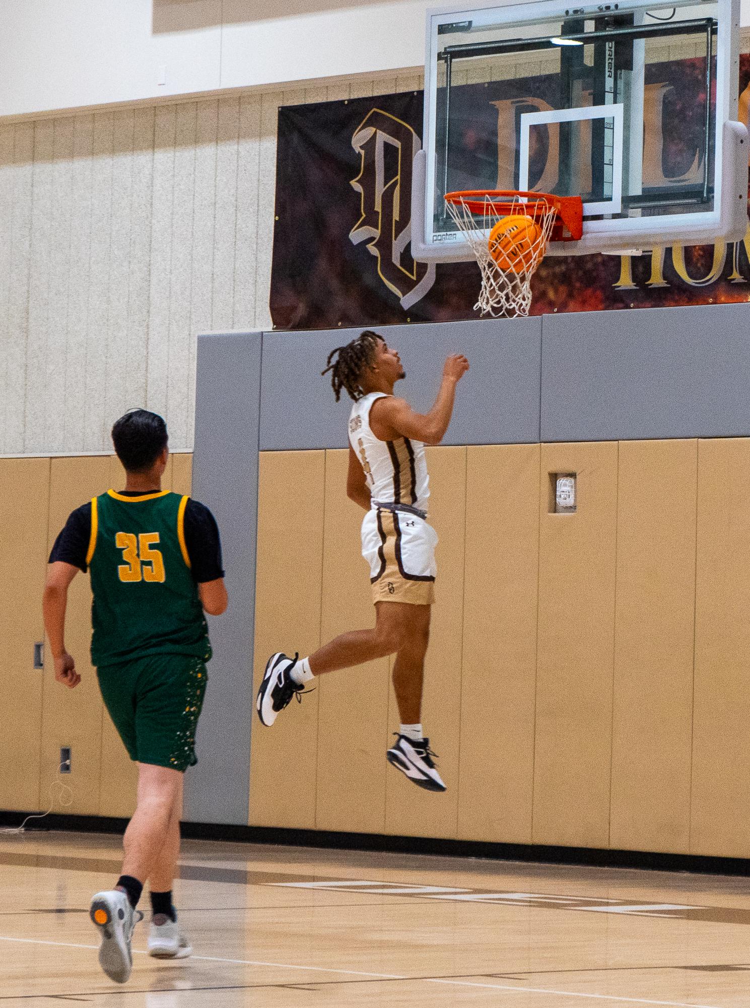 Suns Senior Jaidyn Brown floats to the rim for a layup against West at home on Monday.