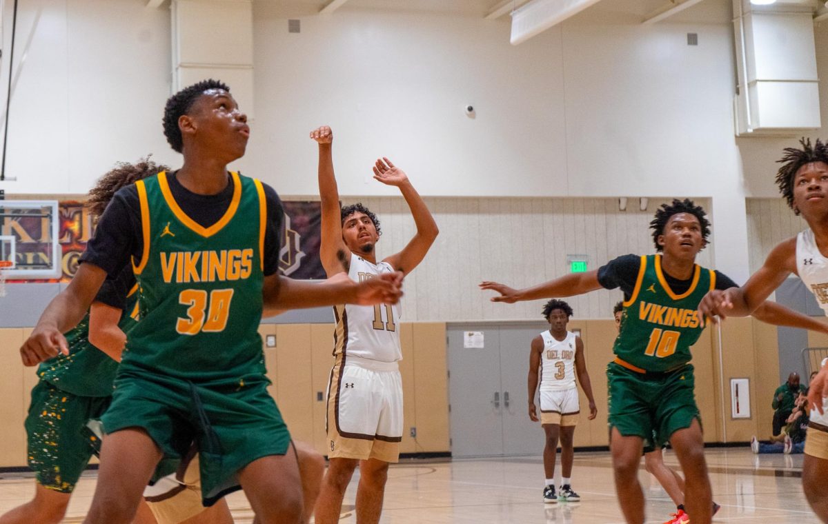 Gabriel Bocardo (center) watched his free throw shot as Antwon Sanders (far right) and a trio of West defenders prepare for a rebound.