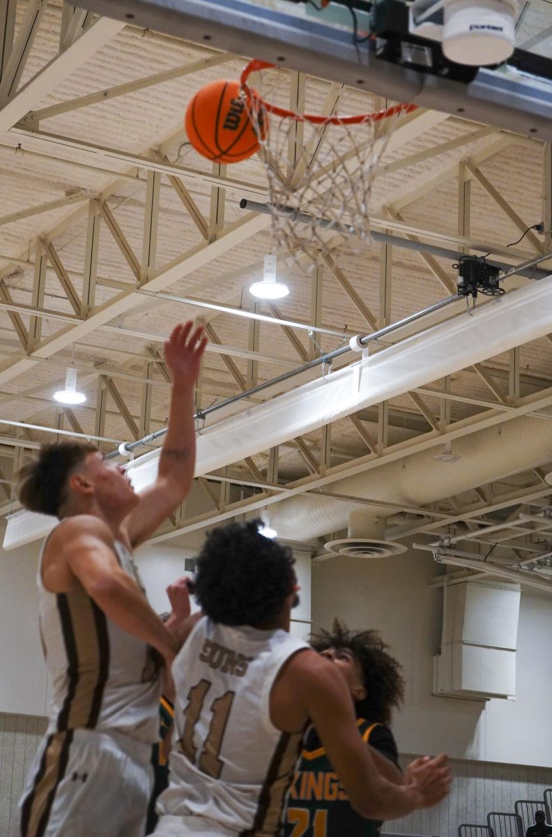 Mark Villa (left) and Gabriel Bocardo fight for a rebound against a Vikings defender.