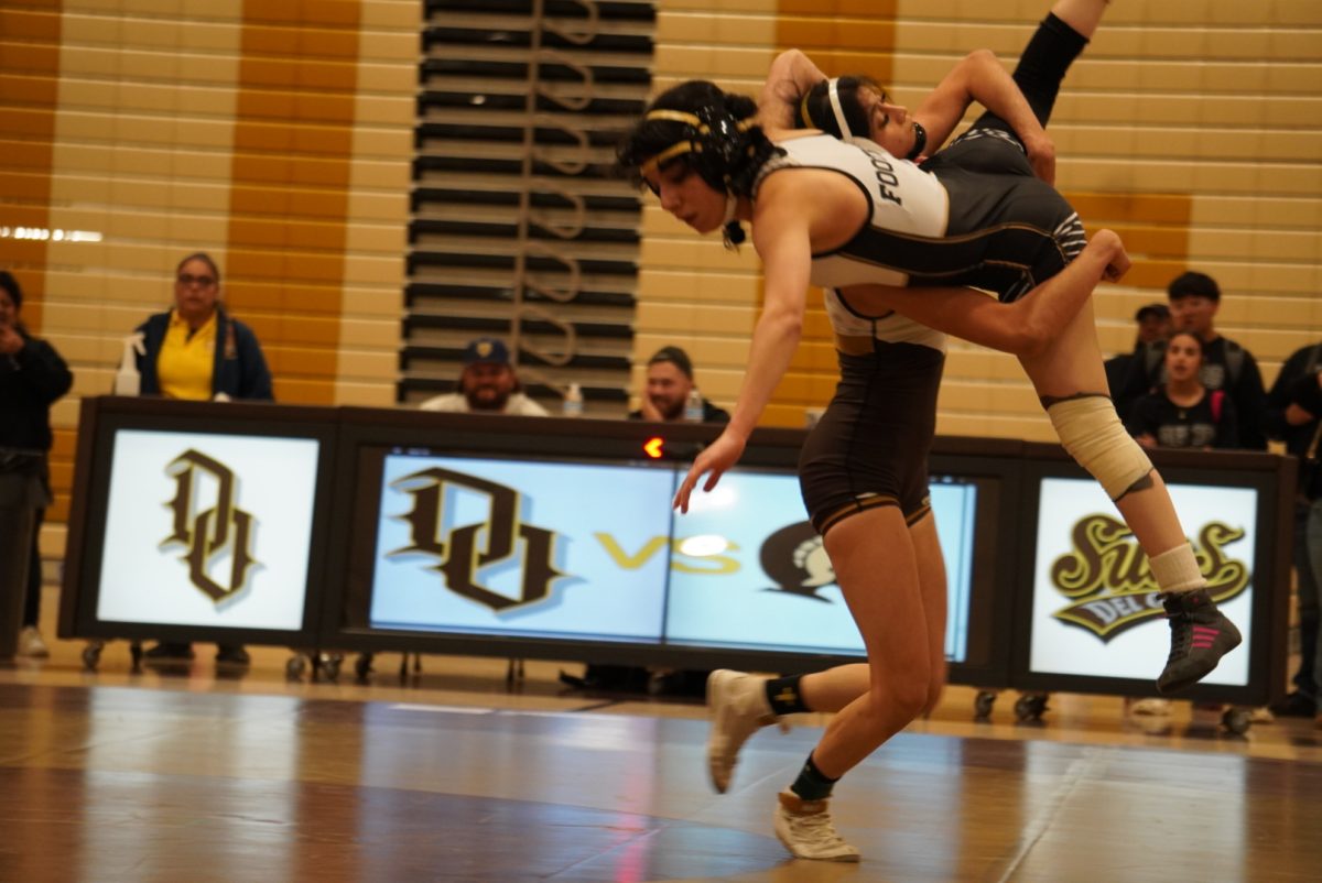 Maria Mejia prepares to slam her opponent to the mat.