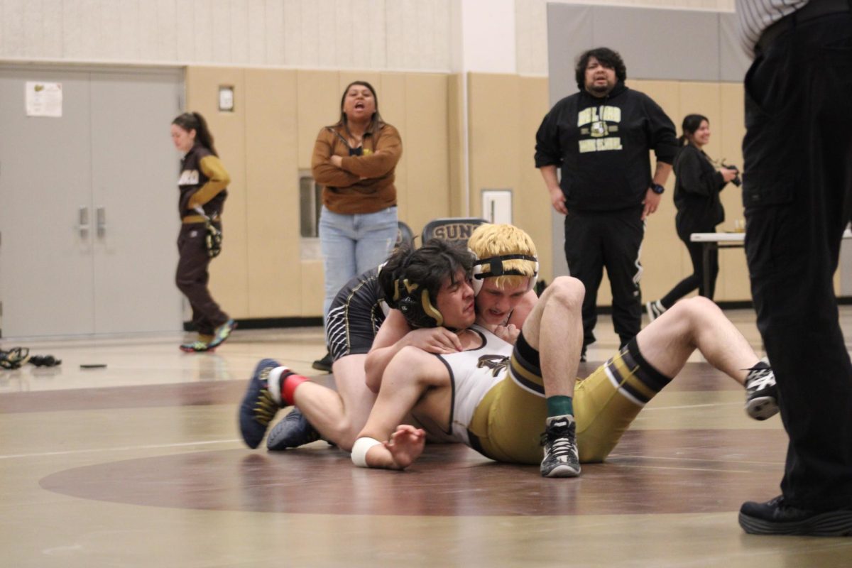 Senior Jayden Zepeda tries to escape from his opponent.