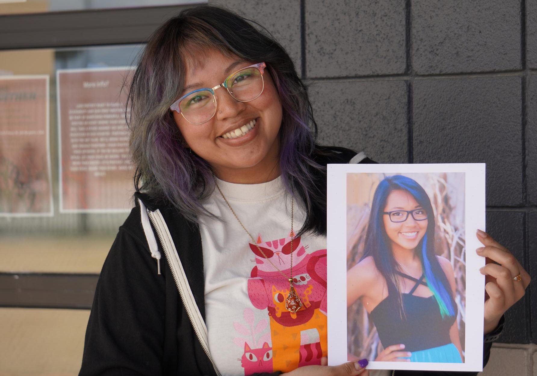 Biology teacher Lynna Ha holds up a photo of their senior portrait. For Del Oro's teachers and staff, this spring has been a time to reflect on what it was like when they were seniors and share those memories with our first graduating class.