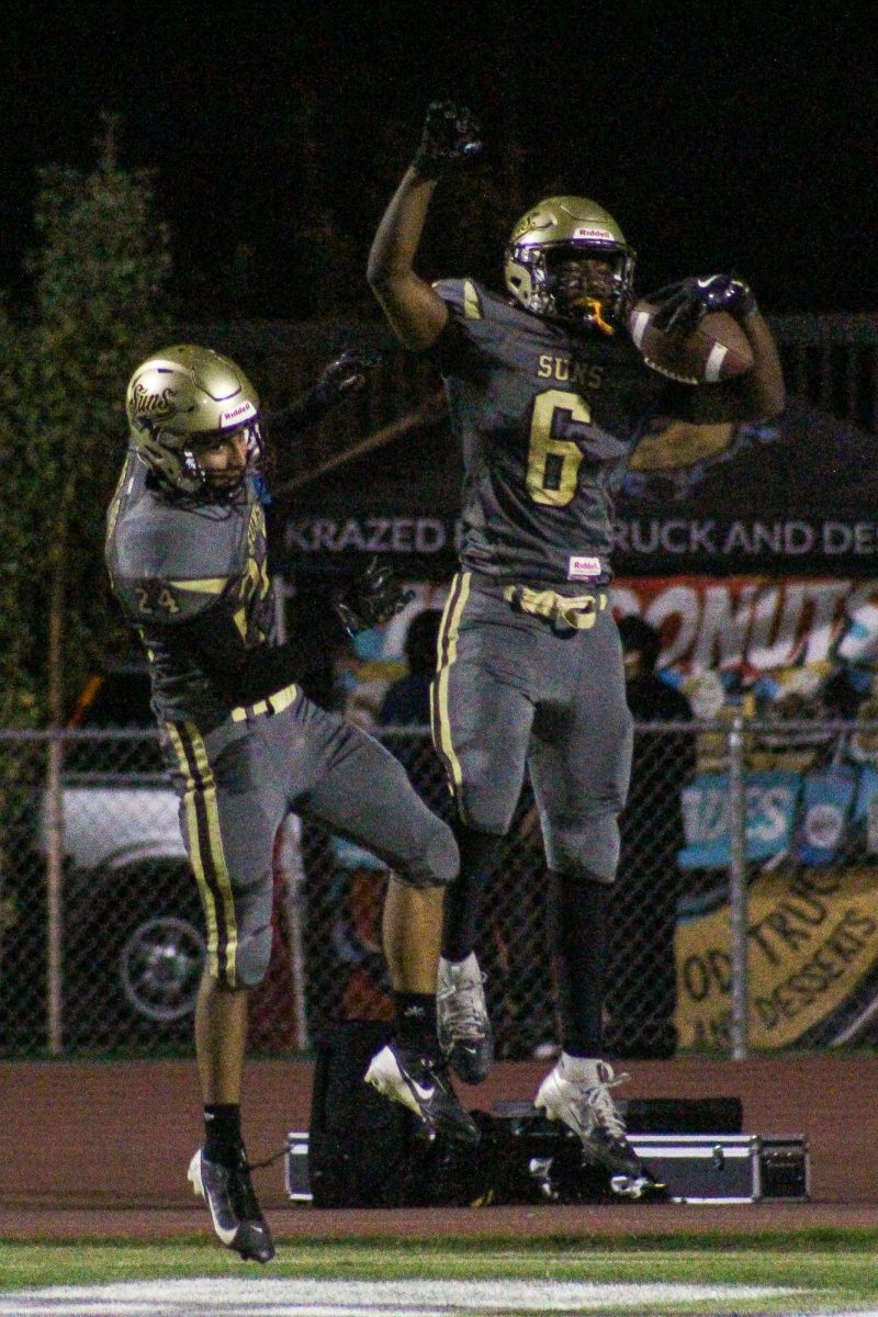 Dareon Sterling (right) and Adrian Gracian celebrate after a touchdown during Friday's win over Santa Maria.