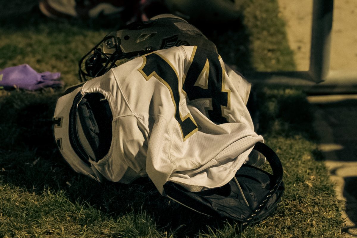 A helmet, shoulder pads and a jersey worn by Del Oro wide receiver Ernest Jones IV lay on the sidelines during Friday's game at Mira Monte. The senior wideout was one of several Suns whose frustrations took over during the loss against the Lions.