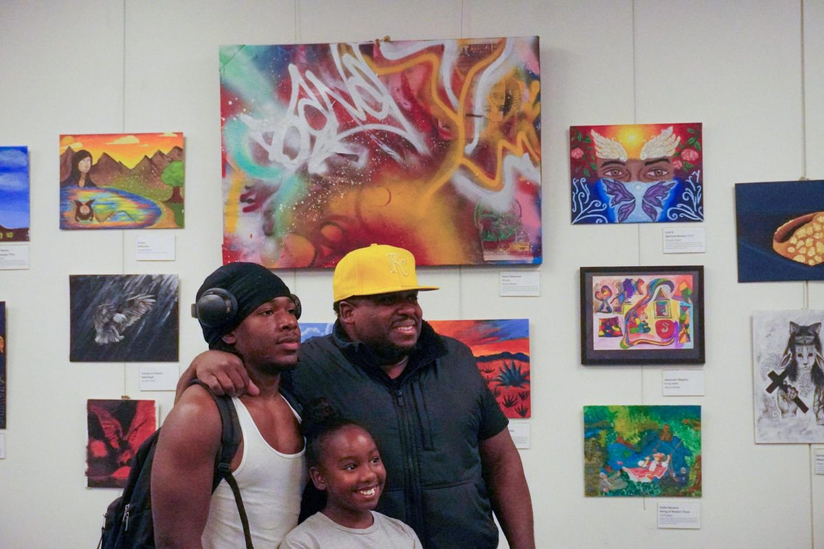 Senior Gavin Roberson (left) poses with family members during Thursday's exhibit.