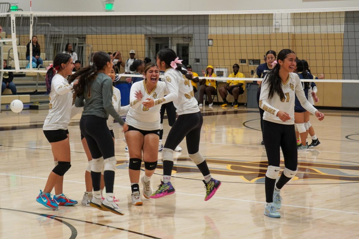 (L to R) Suns volleyball players Valerie Vargas, Danna Arellano, Nayomi Mosqueda, Emery Martinez, Lynneah Garza and Viviana Vasquez celebrate after the team beat Golden Valley, 3-0, at home on Wednesday. It was the volleyball team's first win since moving up to varsity play three seasons ago.