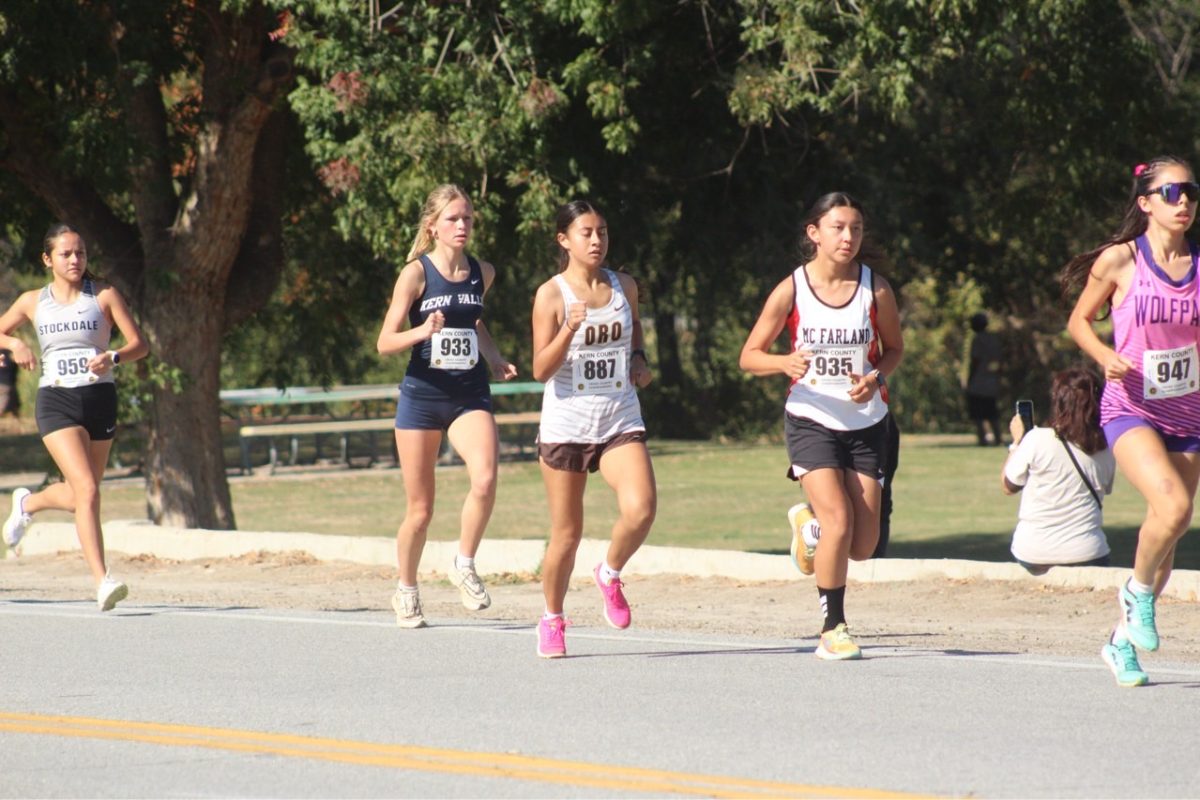 Sonia Alba (center) was the top finisher for the girls cross country team at Saturday's Kern County Championships.