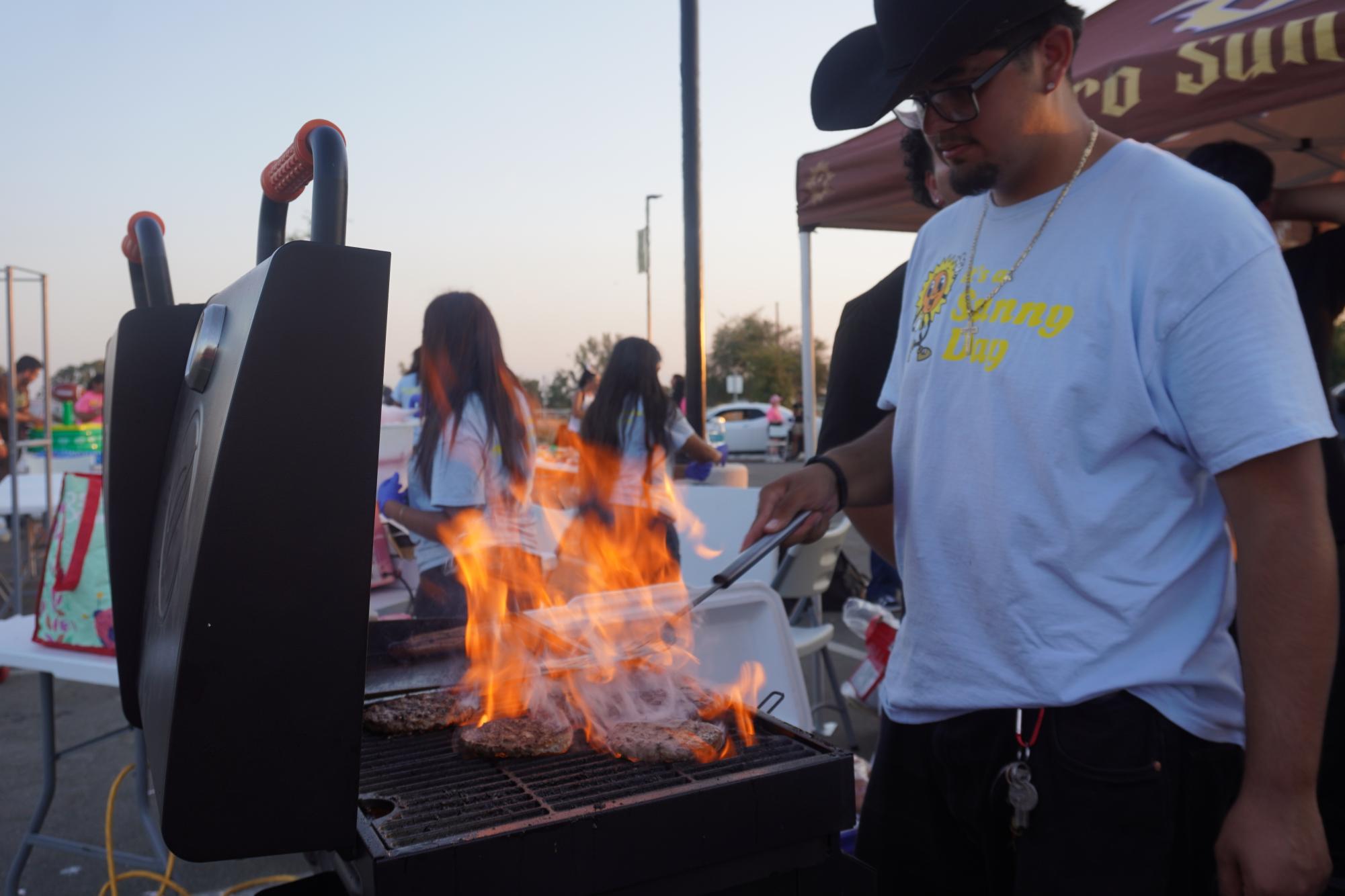 Senior Jason Jimenez was in charge of the grill during Link Crew's home-opening tailgate party on Sept. 5.