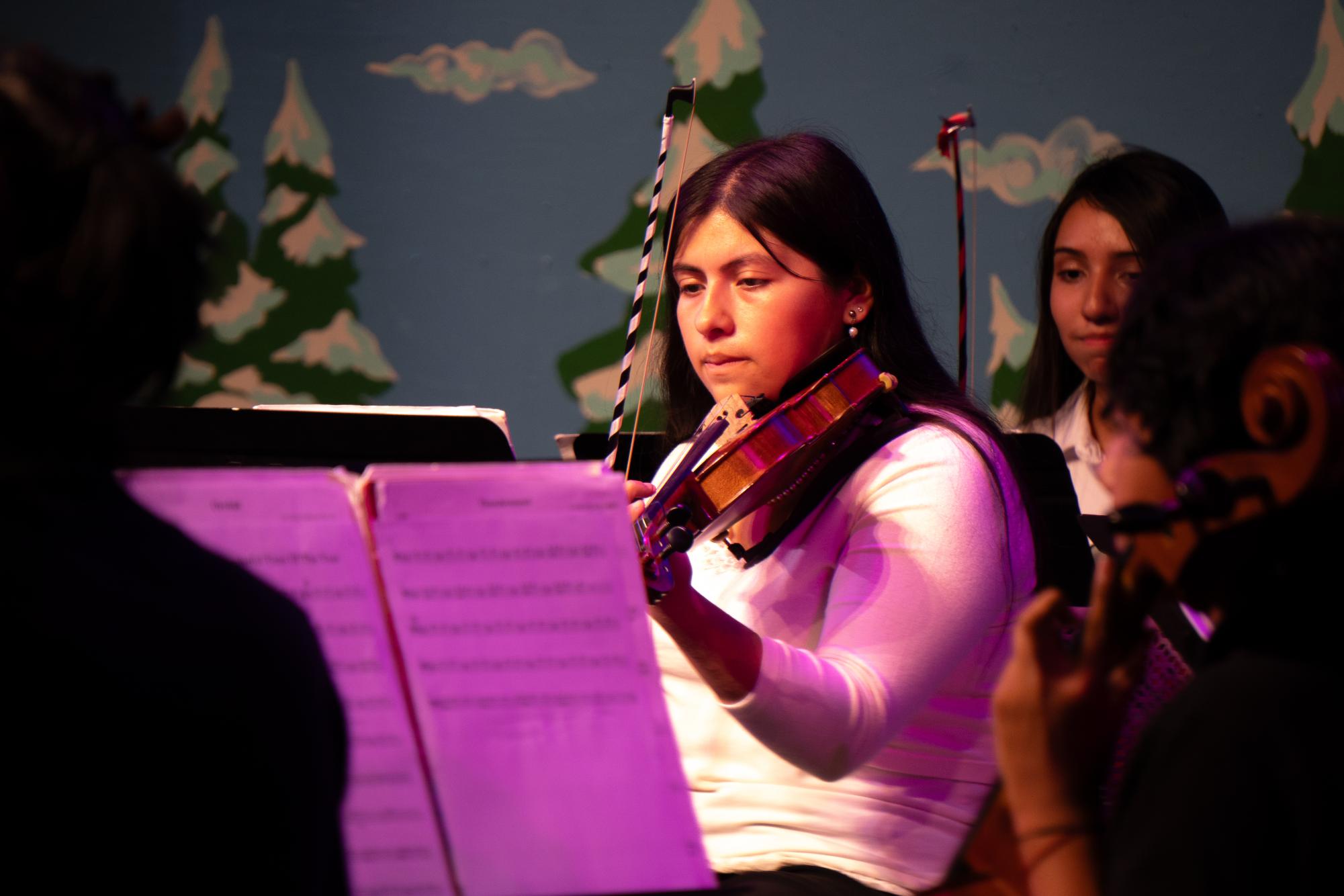 Senior violinist Saraya Garza perfoms "ThunderSnow!" during the Music department annual Winter concert on Thursday.