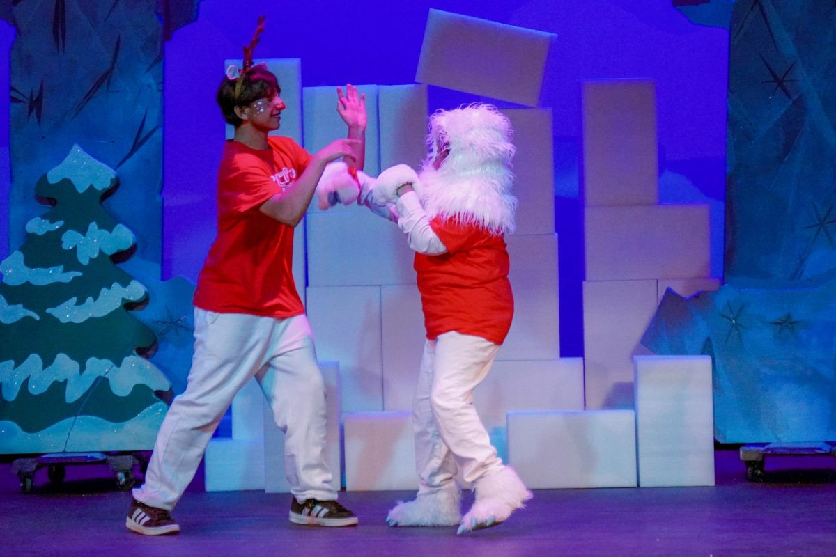 Rudolph (Henry Rubalcado) and Bumble the Abominable Snow Monster (Mason Ostorga Gonzalez) in a scene from the Del Oro Theater department's production of Rudolph the Red-Nosed Reindeer, Jr.
