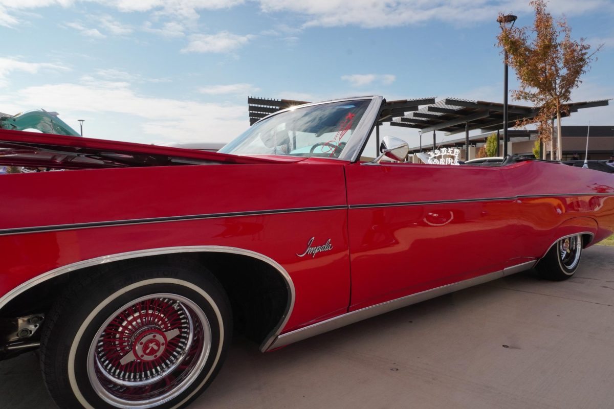 This year's car show saw the return of Jorge Carlartas with Aztec Image and his red 1971 Chevrolet Impala.