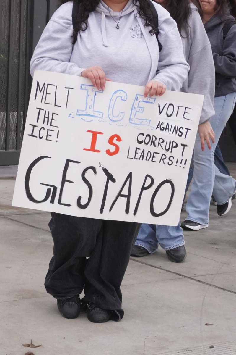 Various signs were carried by students during the walkout to the Liberty Bell in downtown Bakersfield that denounced federal border officials' treatment of immigrants.