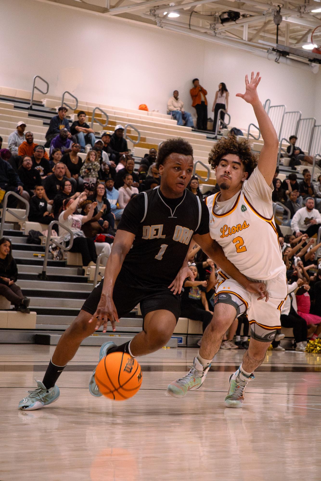 Suns point guard Keenan Starling drives past Mira Monte's Anthony Beckman during Tuesday's key SYHL showdown. Del Oro beat the Lions, 72-58.