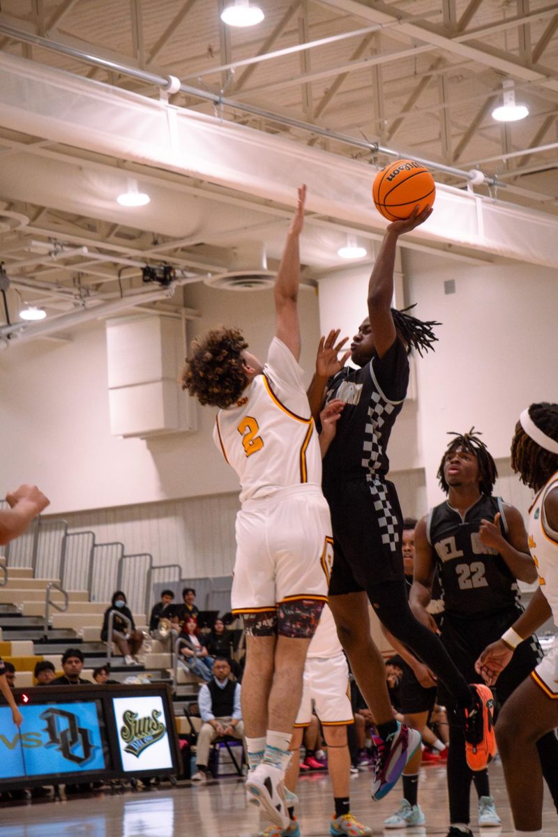 Ernest Jones IV shoots the ball over Mira Monte’s Anthony Beckman.